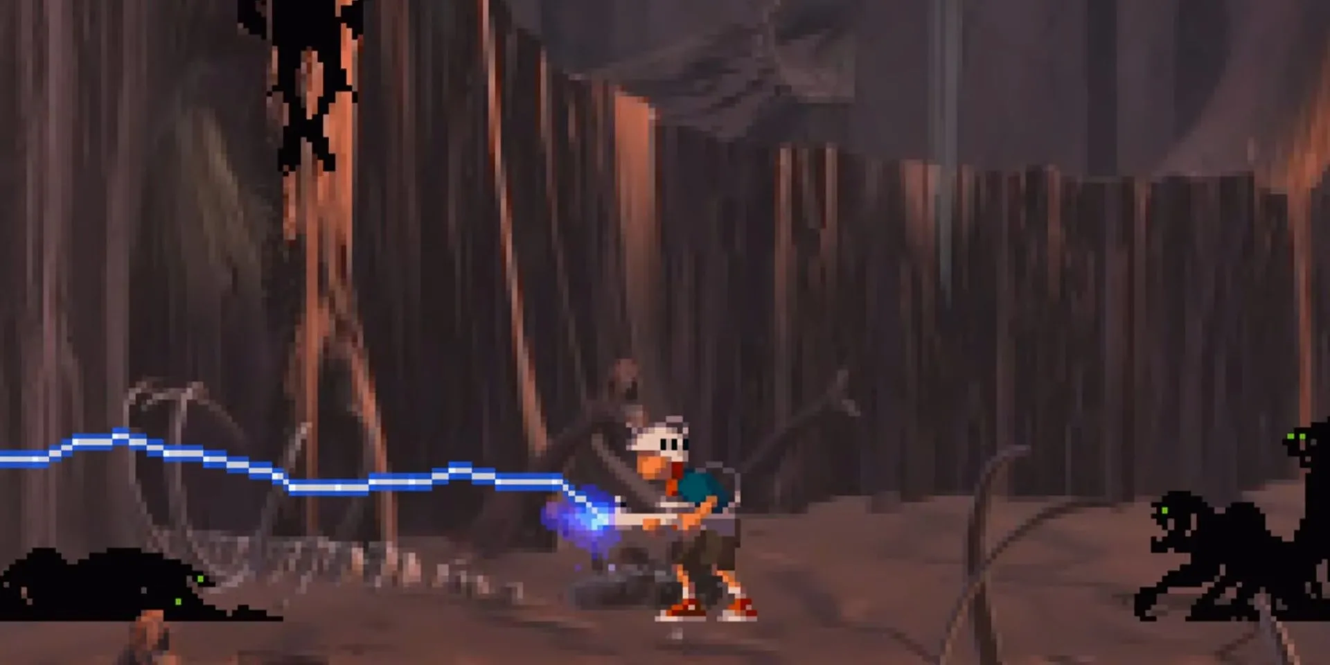 Andy đang bắn vào quái vật trong Heart of Darkness, một game platformer PS1 với những cái chết tàn khốc và kỳ quặc