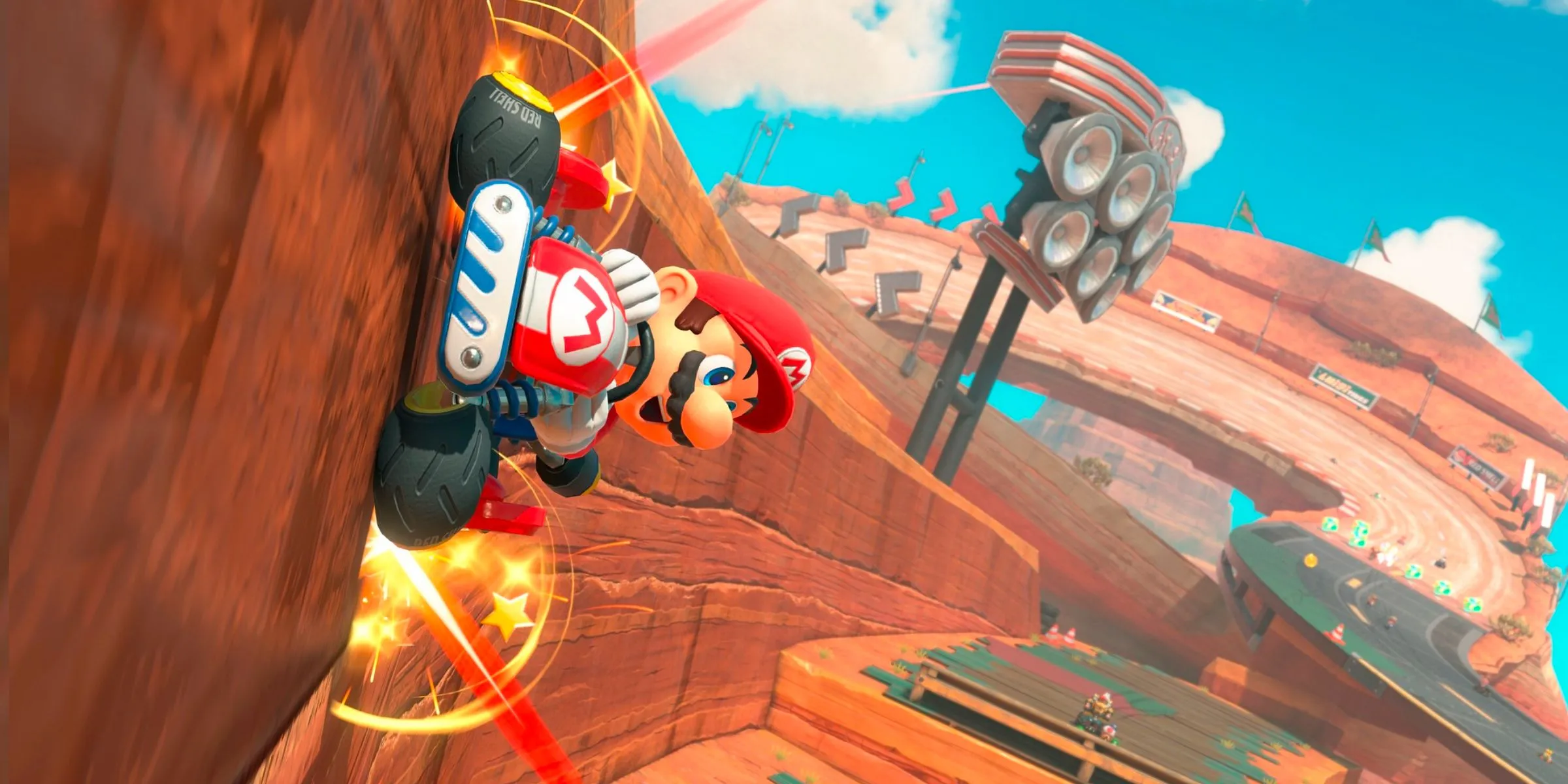 Mario đang chạy trên tường trong đường đua Mario Bros. Circuit trong Mario Kart World.