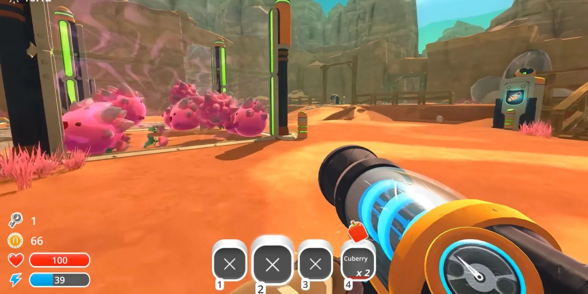 Nhân vật đang nhắm ống hút vào một nhóm slime màu hồng trong Slime Rancher